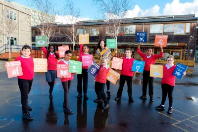 Children holding SDG cubes