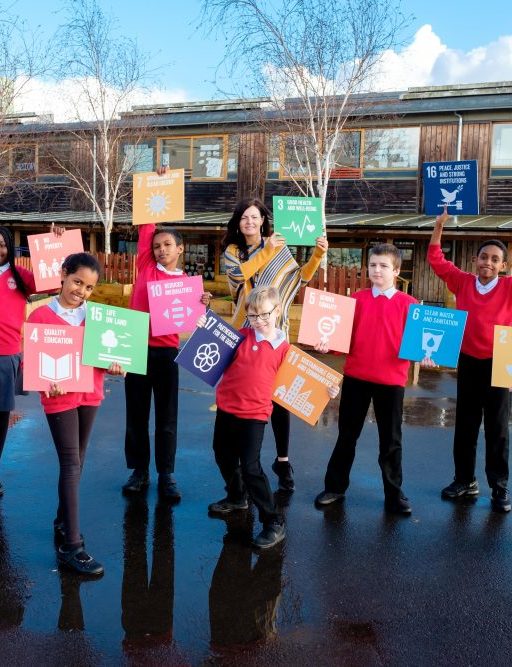 Children holding SDG cubes